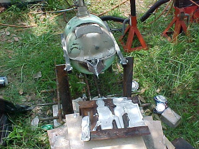 front view of the freon tank reverb furnace with its first pour of recycled aluminum